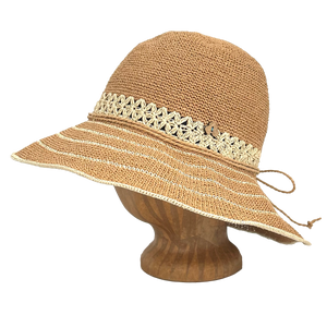 Side view of Brown Sugar Weave Frida Toyo Straw Sun Hat, hand-crocheted with wide brim and adjustable sweatband.