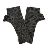 A pair of dark gray and black heathered ribbed knit fingerless gloves laid flat on a white background.