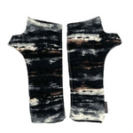 Gemini Wrist Warmers in abstract colorway of black, brown, white, blue, grey – front view showing lined upcycled cotton jersey fabric