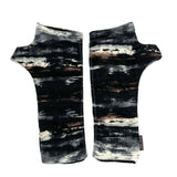 Gemini Wrist Warmers in abstract colorway of black, brown, white, blue, grey – front view showing lined upcycled cotton jersey fabric