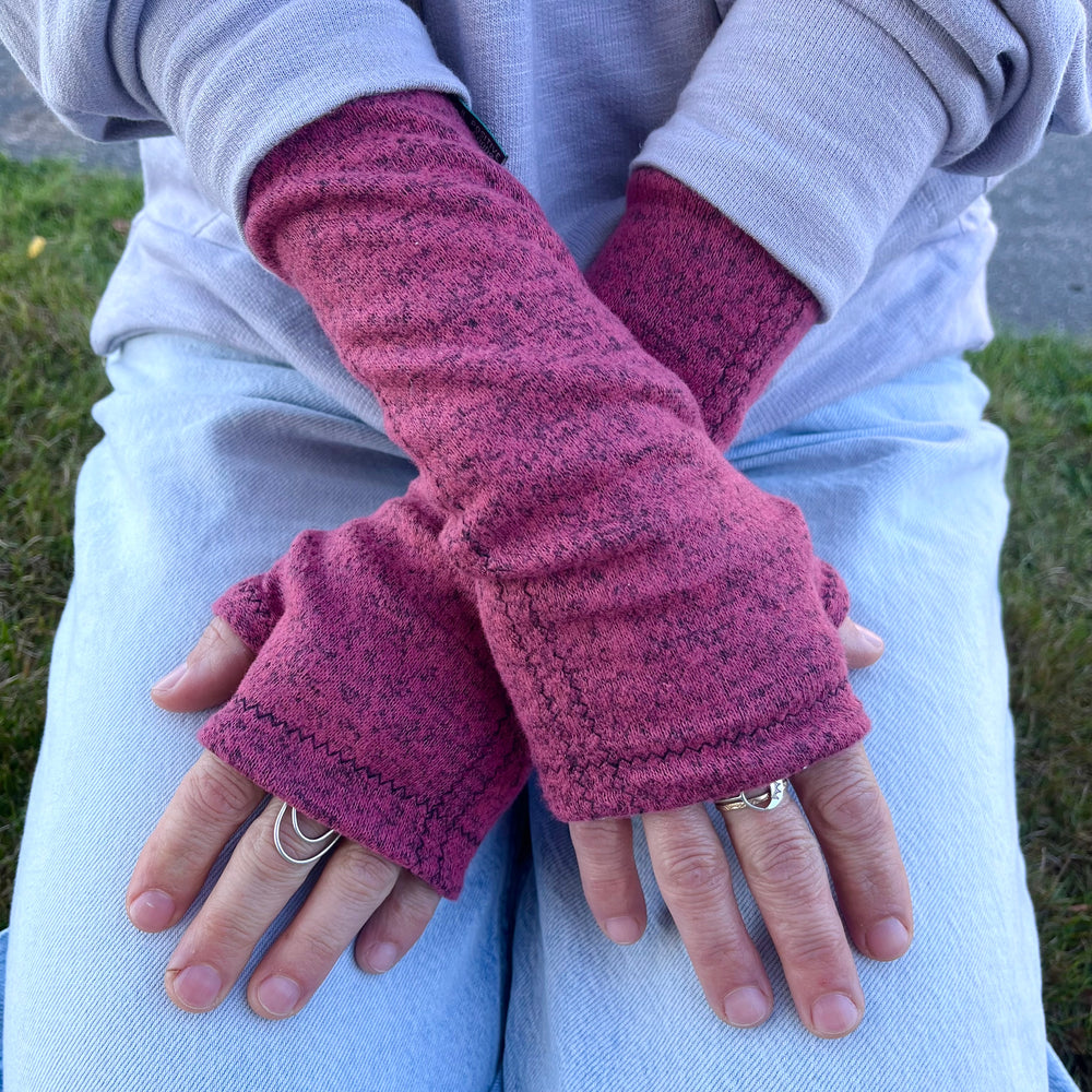 Gemini Wrist Warmers in berry colorway – worn by female model, styled look front