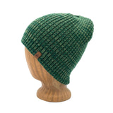 Hemingway Beanie in Fern green color – worn on wooden head block.