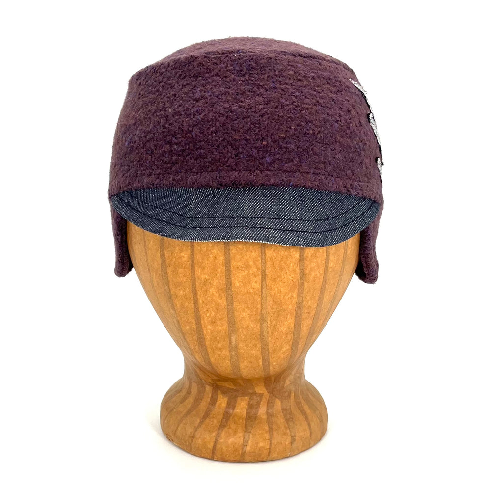 Front view of the Kenji Hat for Kids made from eco-friendly fabric and ear flaps.