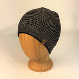 Kids Bigfoot Beanie in mirage oak color way on wood head block, profile view 