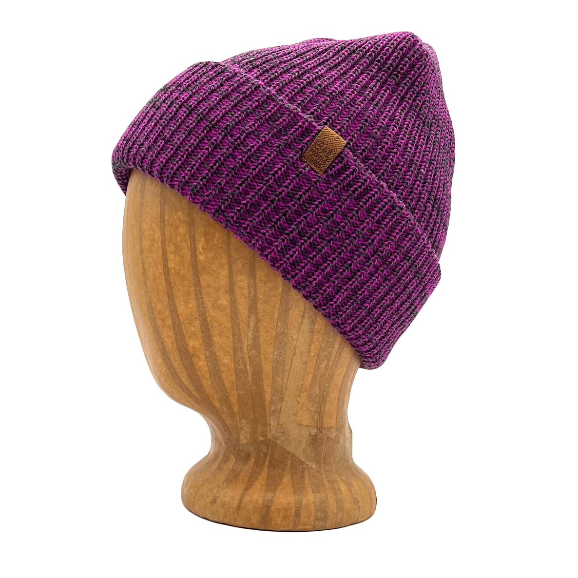 Oaktown Beanie in Dalhia color – worn on wooden head block.