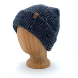Oaktown Beanie in Dark Night color – worn on wooden head block.