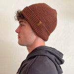 Oaktown Beanie, rust color on male model – sustainable ribbed knit hat
