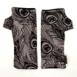 Pacifica Wrist Warmers in black line drawing of peacock feathers on light grey color background  – upcycled fingerless gloves front view
