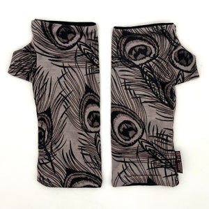Pacifica Wrist Warmers in black line drawing of peacock feathers on light grey color background  – upcycled fingerless gloves front view
