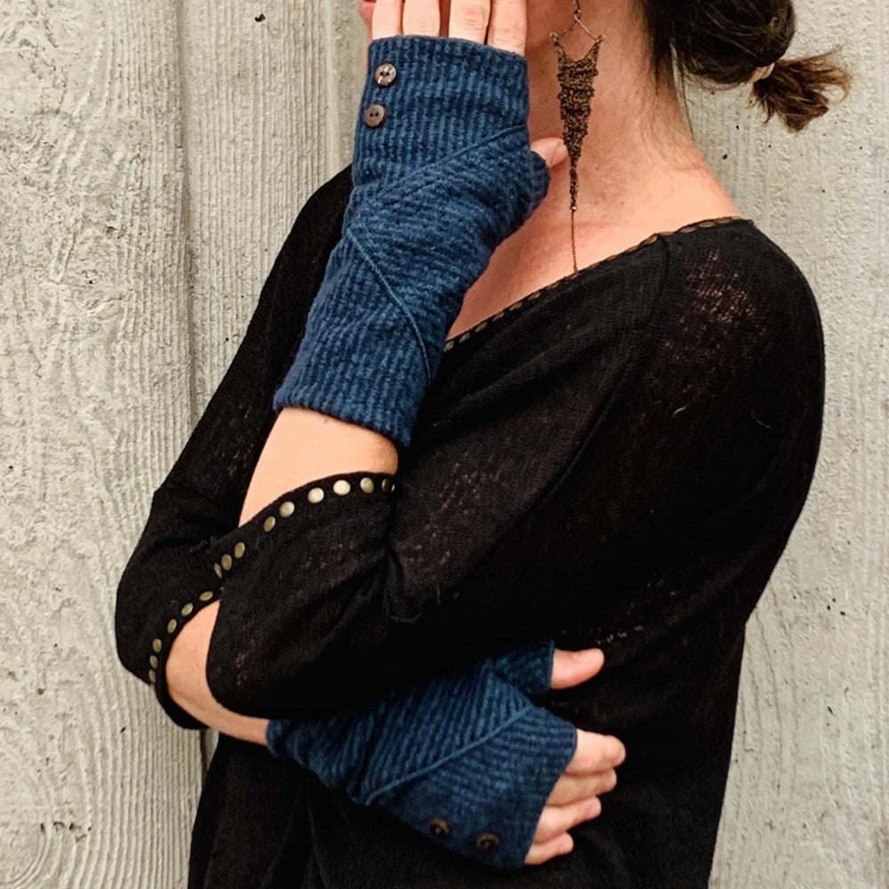 Phoenix Wrist Warmers in marine blue color way – Profile of female model wearing recycled gloves
