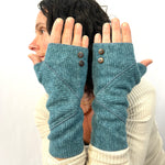 Phoenix Wrist Warmers in sapphire blue color way – front view of Female Model Wearing Recycled Gloves