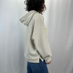 Sea Breeze Hoodie in French Linen – female model sporting side profile , dropped shoulders.