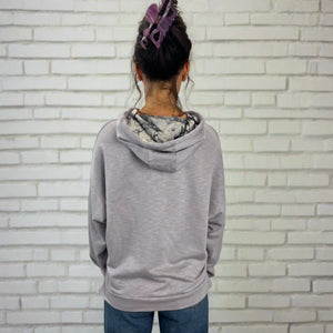 Sea Breeze Lilac Hoodie female modeling showing back view – lightweight upcycled cotton blend women's hoodie