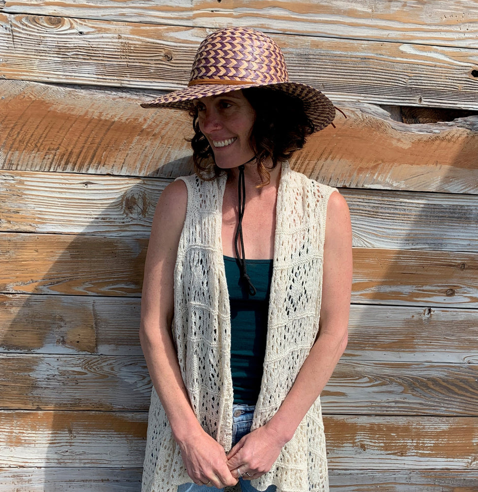 Female model wearing Shadow Sun Hat profile view – adjustable chin strap sun protection
