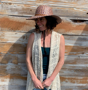 Female model wearing Shadow Sun Hat profile view – adjustable chin strap sun protection
