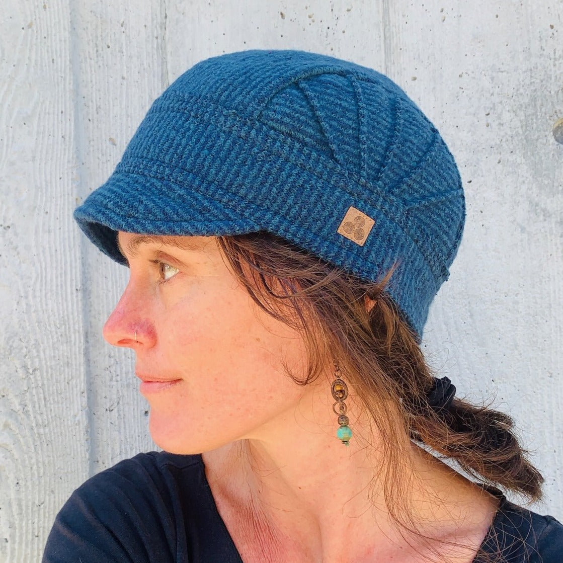 Solstice Soft Cap on female model in marine blue color way – USA made recycled cotton hat