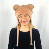 Teddy Kids Beanie – worn by girl model, showcasing animal ears and rosey color