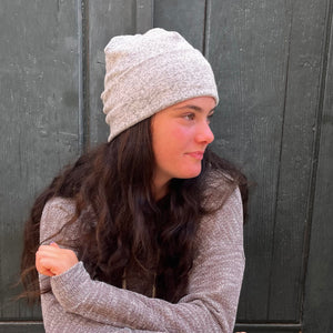 UP Beanie in Snow color way – worn by female model in outdoor setting.