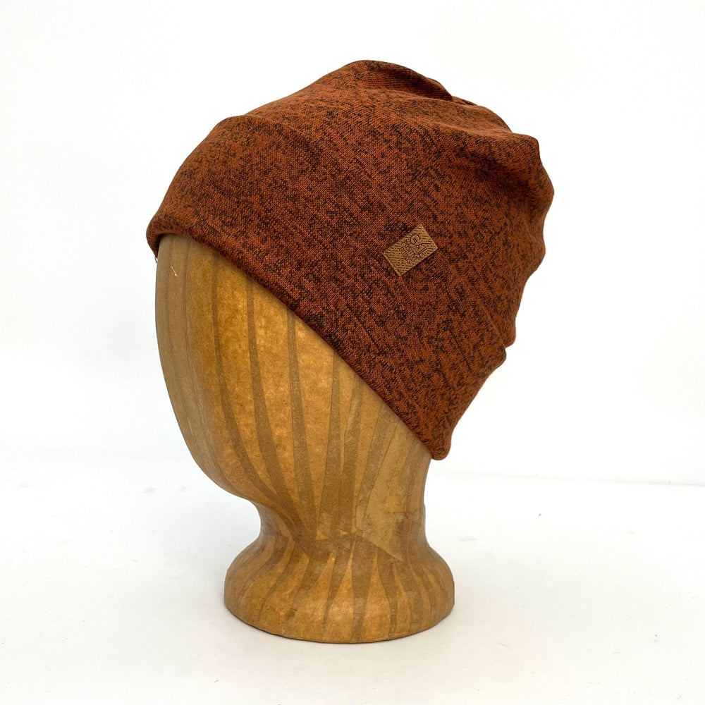 UP Beanie in Auburn color – worn on wooden head block.
