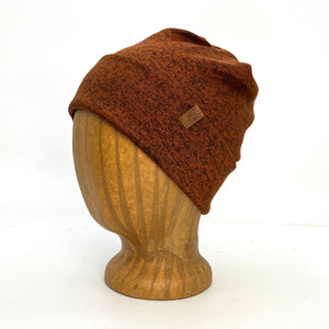 UP Beanie in Auburn color – worn on wooden head block.