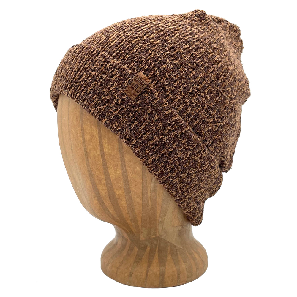 UP Beanie in Caramel color – worn on wooden head block.