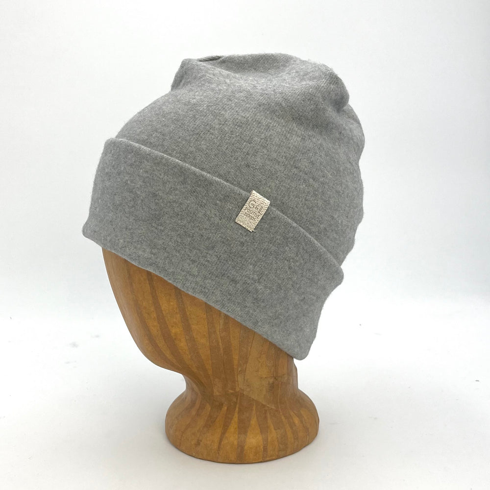 UP Beanie in Auburn our Cloud color – worn on wooden head block.