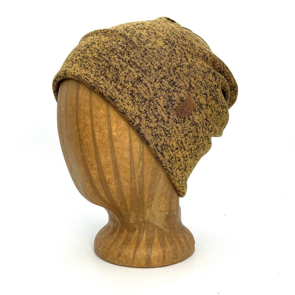 UP Beanie in Harvest Gold color – worn on wooden head block.