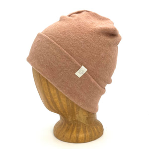 UP Beanie in Rosey Rose color – worn on wooden head block.