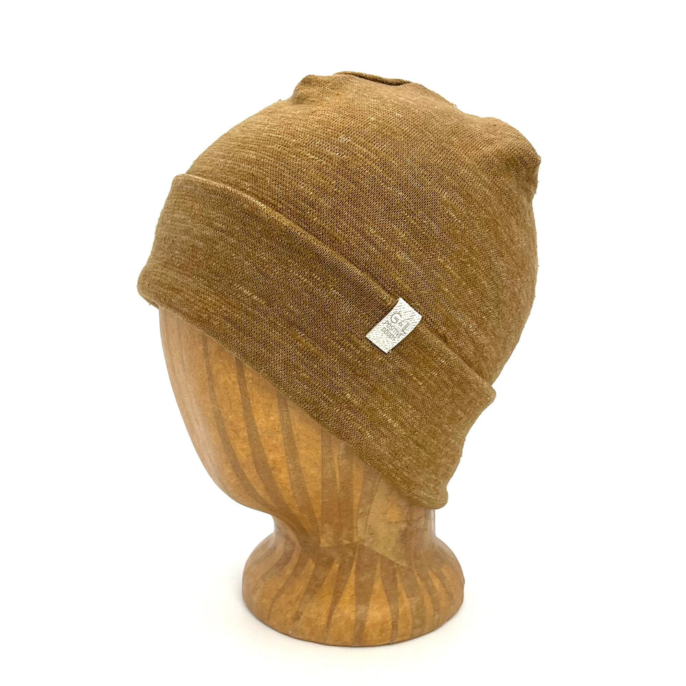 UP Beanie in Sahara color – worn on wooden head block.