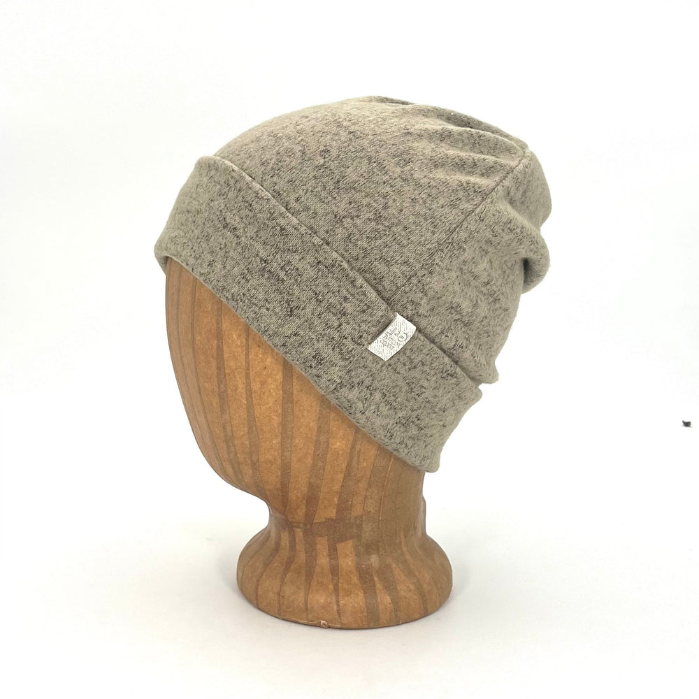 UP Beanie in Tan Marl color – worn on wooden head block.