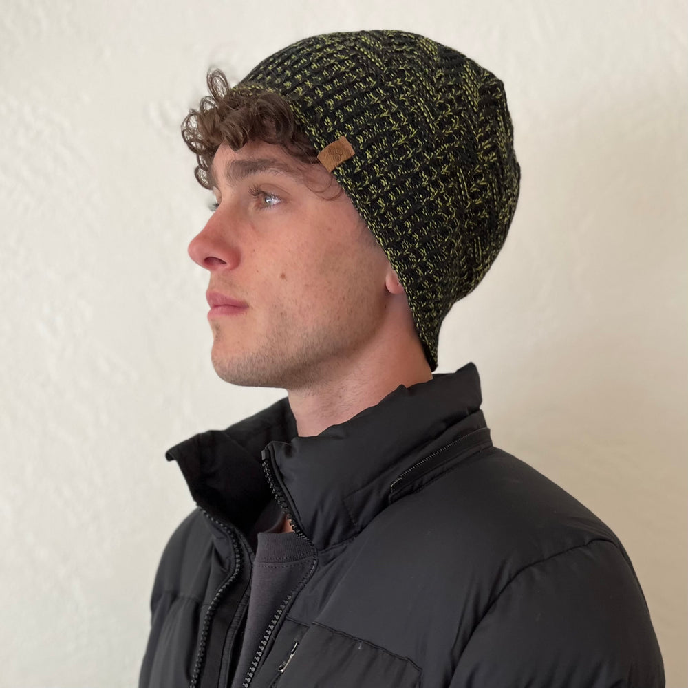 Venice Beanie in Spruce color on female model – stylish and sustainable winter headwear