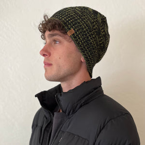 Venice Beanie in Spruce color on female model – stylish and sustainable winter headwear
