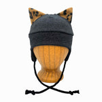 Wildkat Beanie in Black Deep Space color way, front view on wooden head block – fun kids fleece hat with ears by G & L Positive Goods