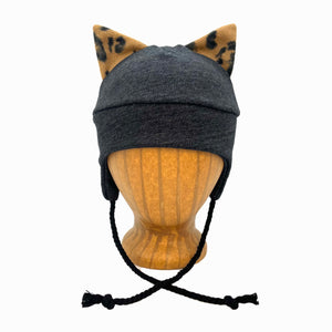 Wildkat Beanie in Black Deep Space color way, front view on wooden head block – fun kids fleece hat with ears by G & L Positive Goods