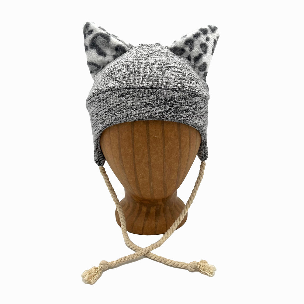 Wildkat Beanie in Storm color way, front view on wooden head block – fun kids fleece hat with ears by G & L Positive Goods