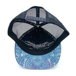 Underside view of the Zen Doodle Trucker Hat, showing flat brim, recycled fabric, and soft interior.