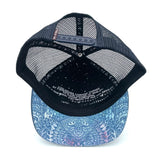 Underside view of the Zen Doodle Trucker Hat, showing flat brim, recycled fabric, and soft interior.