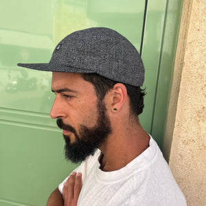 Zig Zag 5 Panel Camp Hat on male model – black and grey herringbone