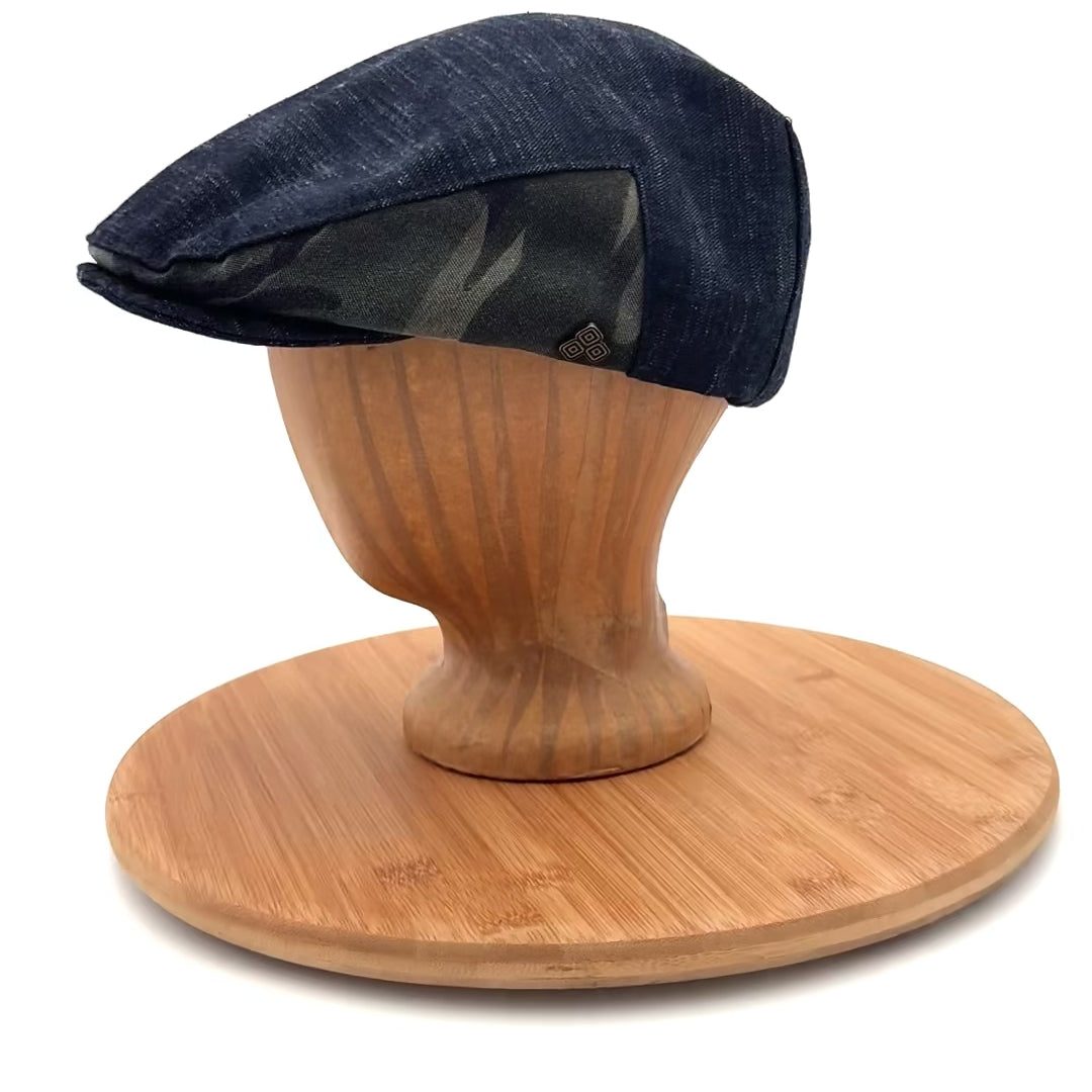Matisse Flat Cap side view video on mannequin head, upcycled black denim flat cap with camo detail