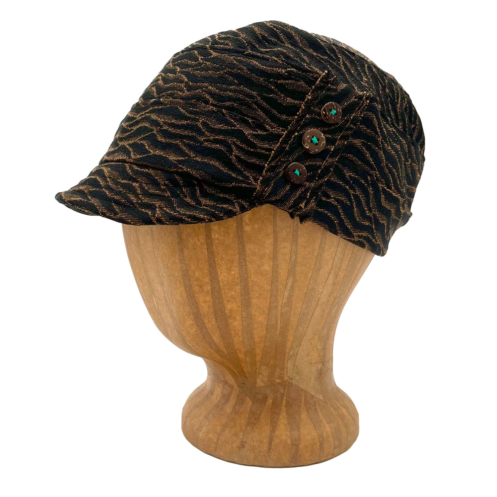 Soft short brim cap. Feminine fit. Pin tucks and buttons. Made in USA from upcycled fabrics and recycled materials *fossil