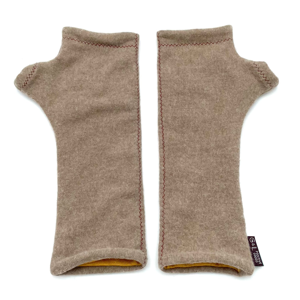 Fully lined wrist warmers. Made in the USA from upcycled fabric. Comes in variety of colors. Shop hand warmers.  sandstone
