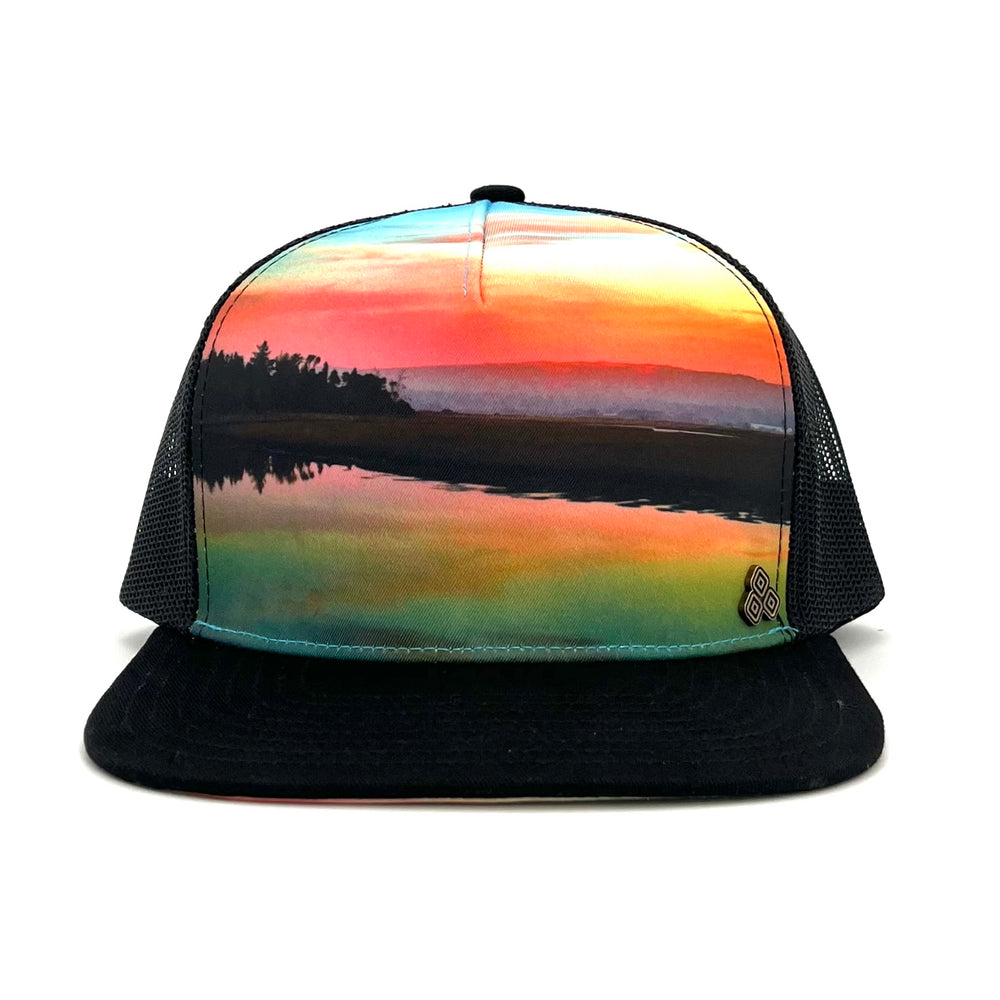 Five-panel low-profile graphic print Horizon Sunset Trucker Hat. Adjustable snap with mesh back. 