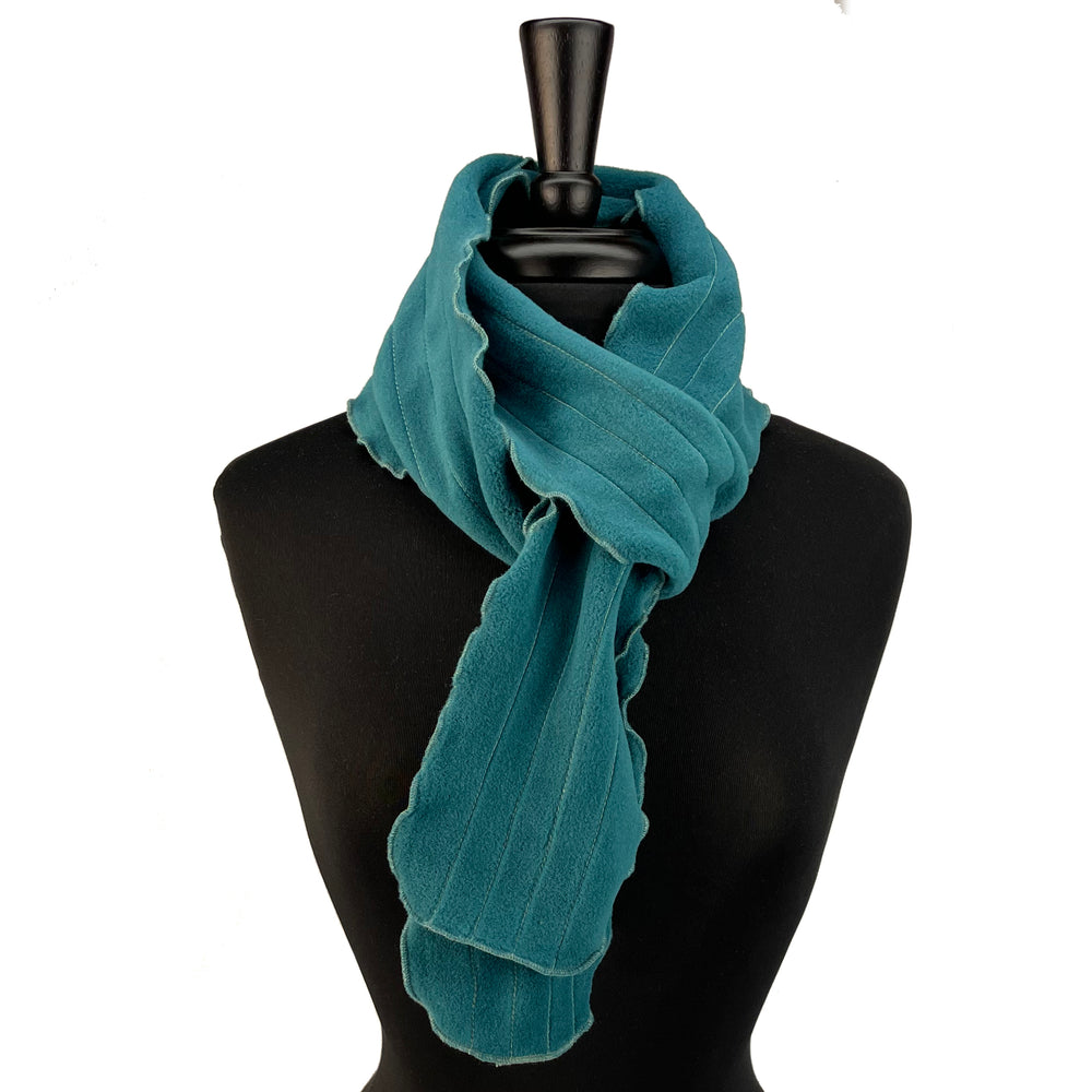 Lightweight fleece scarf with a lettuce edge and contrast stitching. Made in the USA. Shop sustainable scarves. *aquamarine