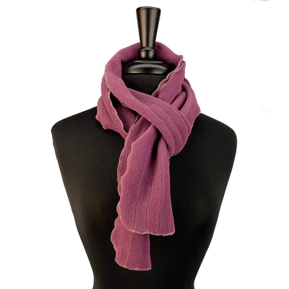 Lightweight fleece scarf with a lettuce edge and contrast stitching. Made in the USA. Shop sustainable scarves. *plum wine