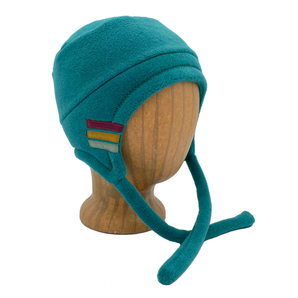 Colorful kids hat with ear flaps and chin straps. Made in the USA from Polartec fleece. Shop sustainable hats. *aquamarine