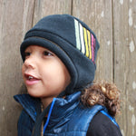 Colorful kids hat with ear flaps and chin straps. Made in the USA from Polartec fleece. Shop sustainable hats. *limousine