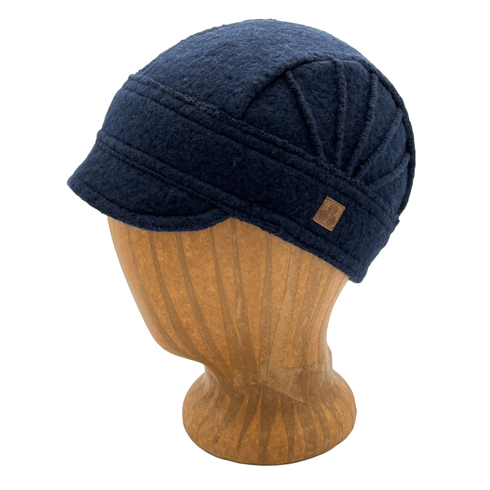 Warm soft cap for women and girls. Our short brim Solstice Hat is embellished with pin tucks. Made in the USA from recycled cotton fabric. Shop sustainable gifts and hats at G and L Positive goods. Designed by Gypsy and Lolo in Northern California. We give three percent of profits to social and environmental causes. *dark-navy
