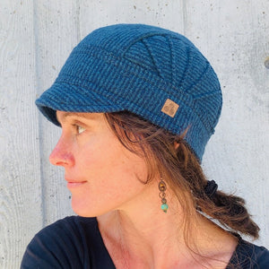 Warm soft cap for women and girls. Our short brim Solstice Hat is embellished with pin tucks. Made in the USA from recycled cotton fabric. Shop sustainable gifts and hats at G and L Positive goods. Designed by Gypsy and Lolo in Northern California. We give three percent of profits to social and environmental causes.  *marine. 